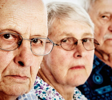 three grumpy seniors two men one woman frowning disappointed rapideye