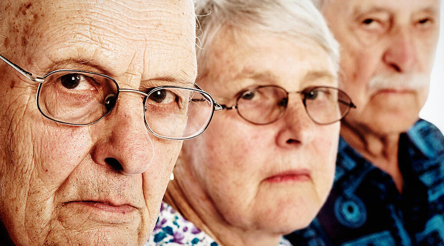 three grumpy seniors two men one woman frowning disappointed rapideye
