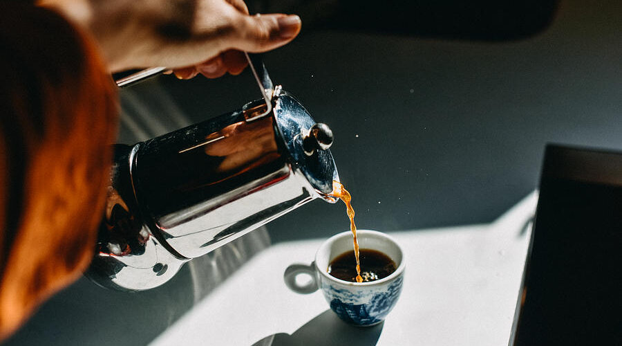 pouring espresso coffee into an espresso cup with a mocha pot stefania pelfini la waziya photography 1